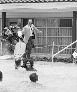 Motel manager pouring acid in the water when black people swam in his pool, 1964